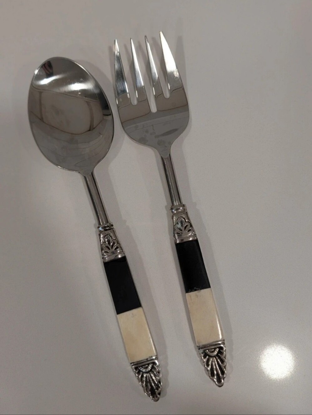 Stainless Steel Serving Spoon & Fork Set with Black and Cream Handles Pottery Ba